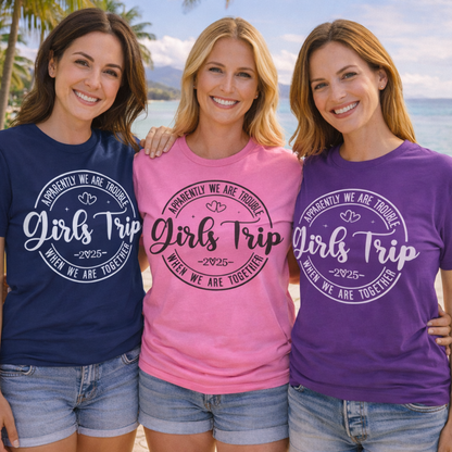 Three women wearing 'Girls Trip' personalized t-shirts on a beach.