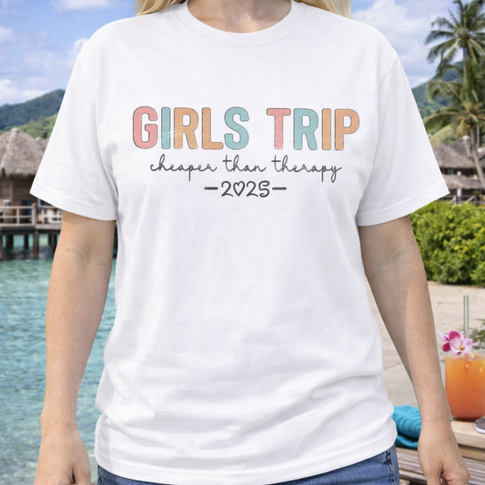 Person wearing a white t-shirt with 'Girls Trip: cheaper than therapy 2025' text that can be personalized.