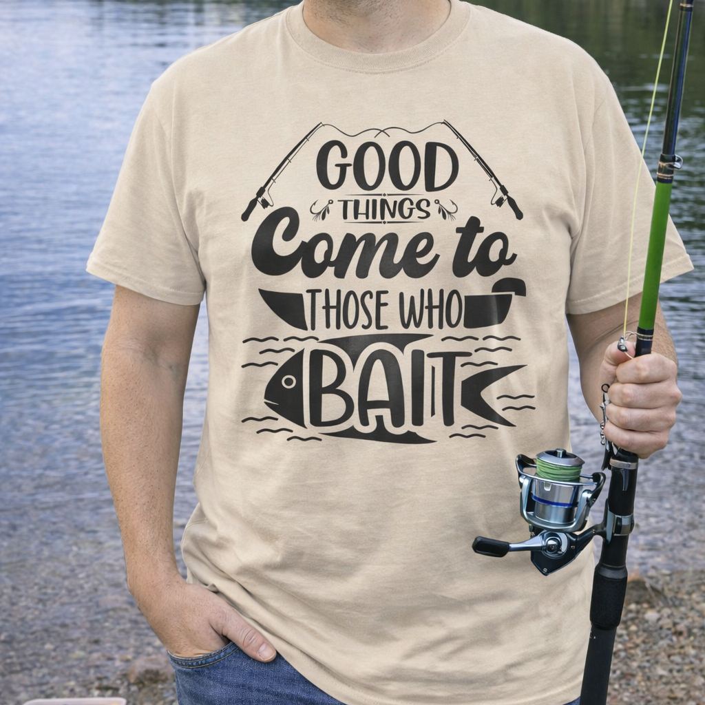 A beige fishing t-shirt with fishing poles and a fish in water with text Good Things Come to Those Who Bait.