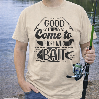 A beige fishing t-shirt with fishing poles and a fish in water with text Good Things Come to Those Who Bait.