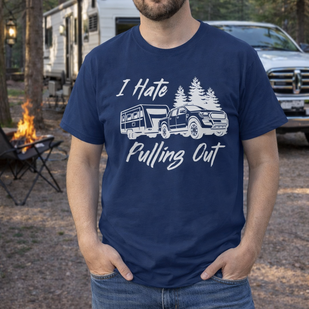 Man wearing a navy blue t-shirt with a graphic of truck pulling an RV and text I Hate Pulling Out.