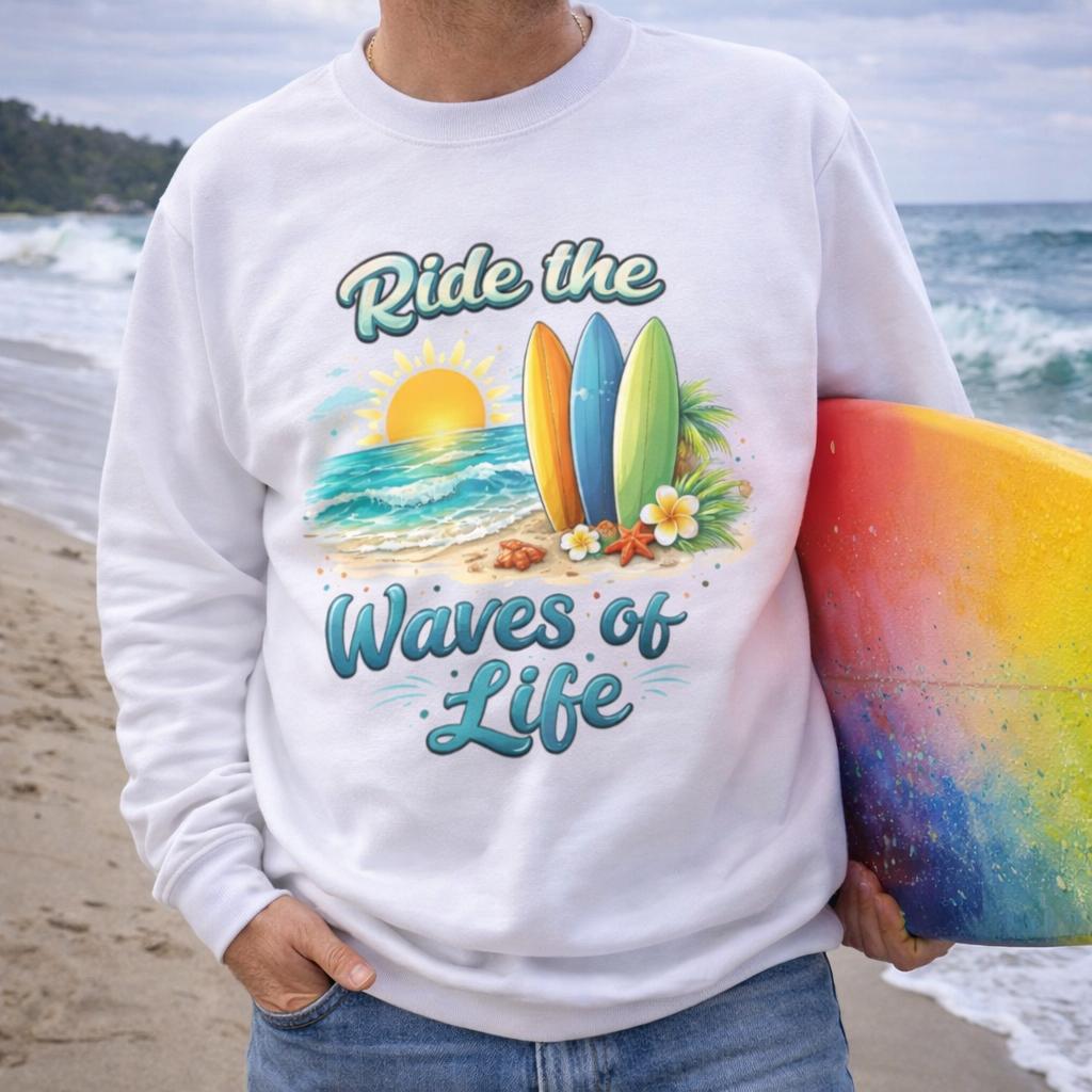 Person wearing a white sweatshirt with a beach-themed design with text Ride the Waves of Life.