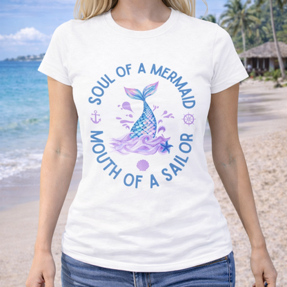 Woman wearing a white t-shirt with a mermaid design with text Soul of a Mermaid Mouth of a Sailor.