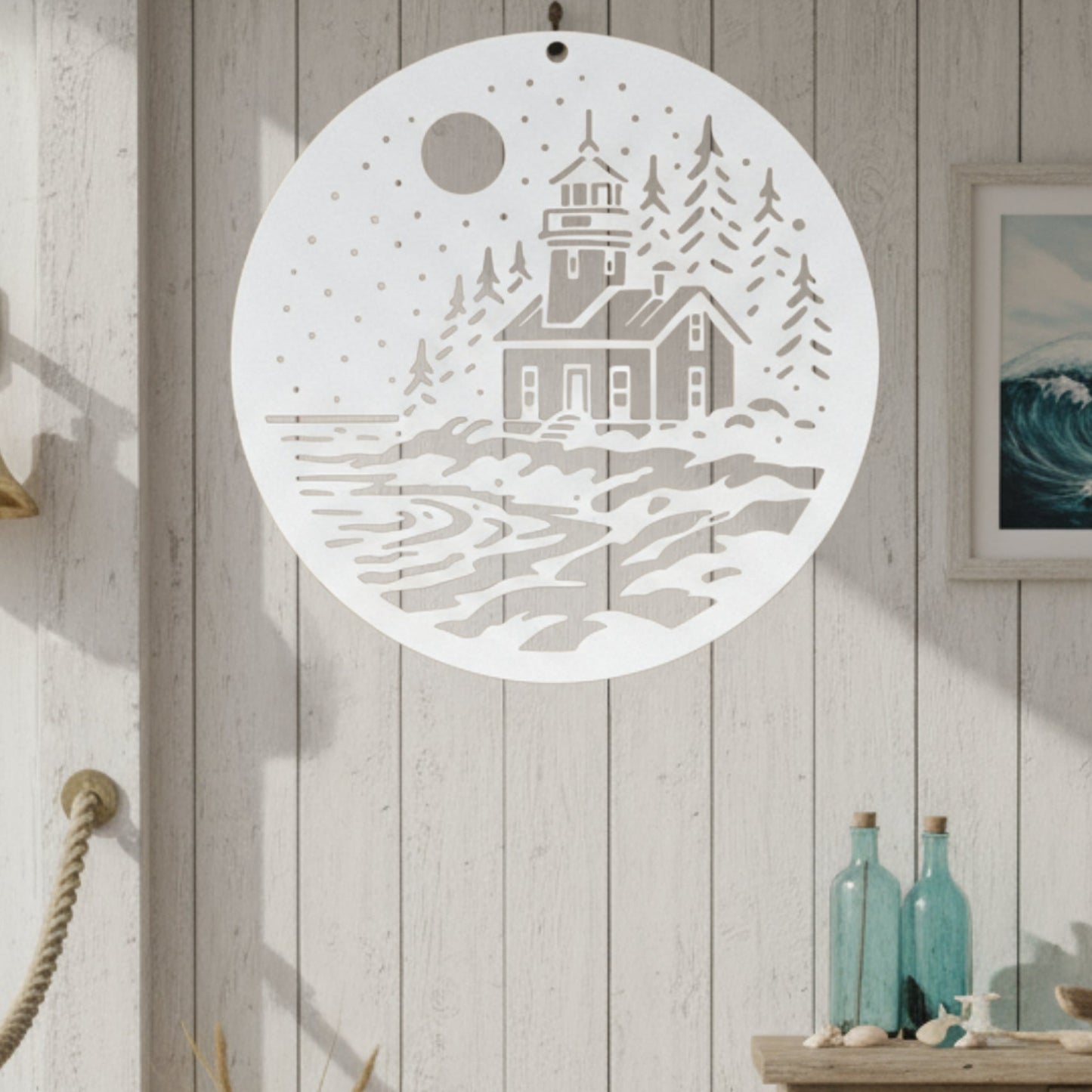 Decorative wall art with a lighthouse design in a coastal-themed room.