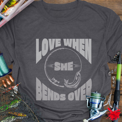 Dark Heather T-shirt with a fishing pole bending over and the phrase “Love When She Bends Over” – humorous fishing design for anglers.