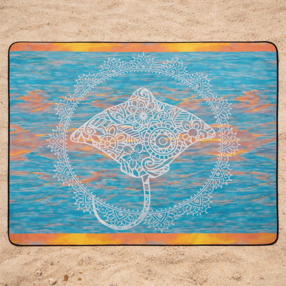 Outdoor beach blanket with orange and turquoise watercolor background with mandala stingray design.