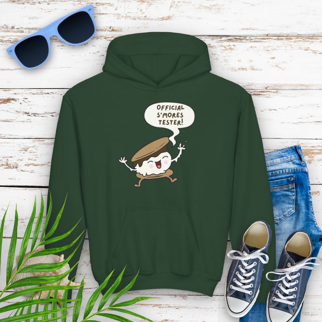 Forest Green Youth hoodie with "Official S’mores Tester" text in a speech bubble with cartoon s'more – fun camping-themed sweatshirt for kid.