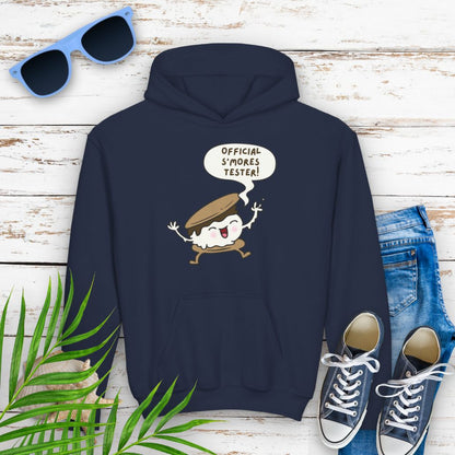 Navy Youth hoodie with "Official S’mores Tester" text in a speech bubble with cartoon s'more – fun camping-themed sweatshirt for kid.