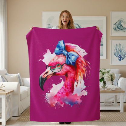 Person holding a pink blanket with a flamingo design in a living room.
