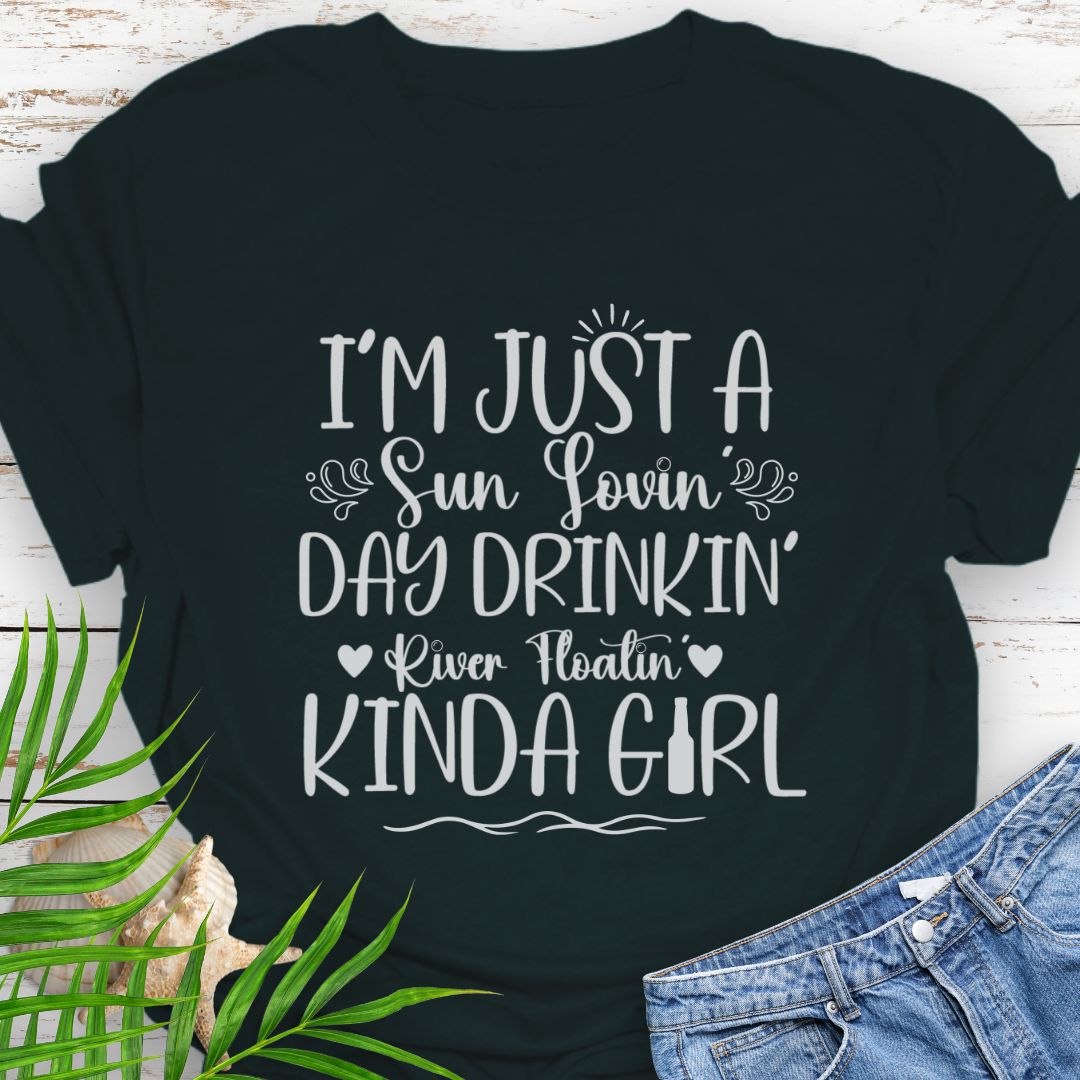 Black Unisex t-shirt with the phrase "Sun-loving, Day-drinking, River-floating Kind of Girl" printed on the front with embellishments, featuring a relaxed fit and soft cotton fabric.
