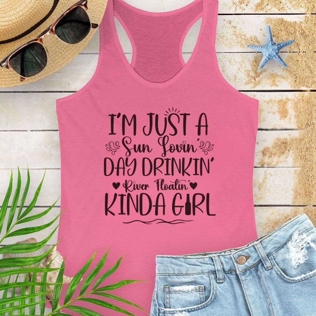 Hot Pink women’s racerback tank top with the phrase "Sun-loving, Day-drinking, River-floating Kind of Girl" printed on the front in a relaxed, summer-ready fit.