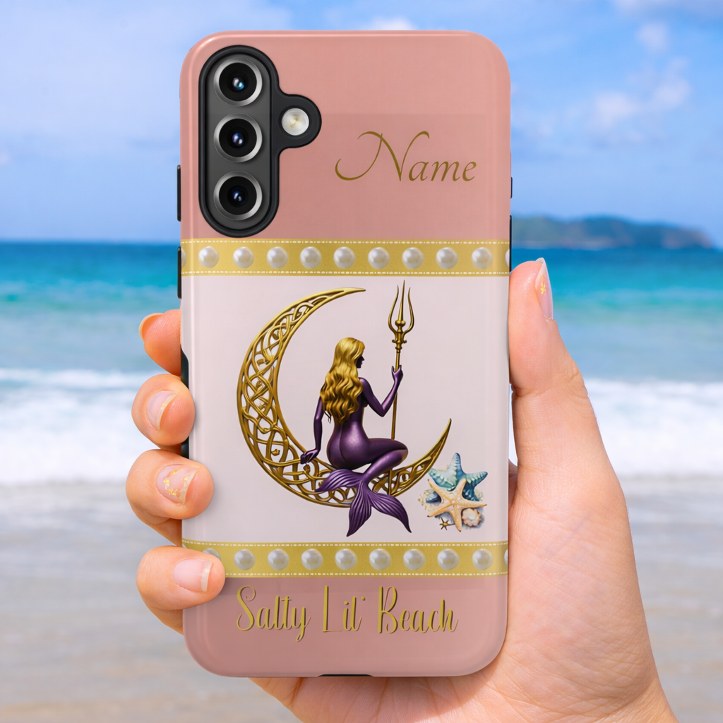 Phone case with mermaid sitting on a gold Celtic crescent moon and holding a trident with the text 'Salty Lil' Beach' on a pink and white background held by a hand on a beach background