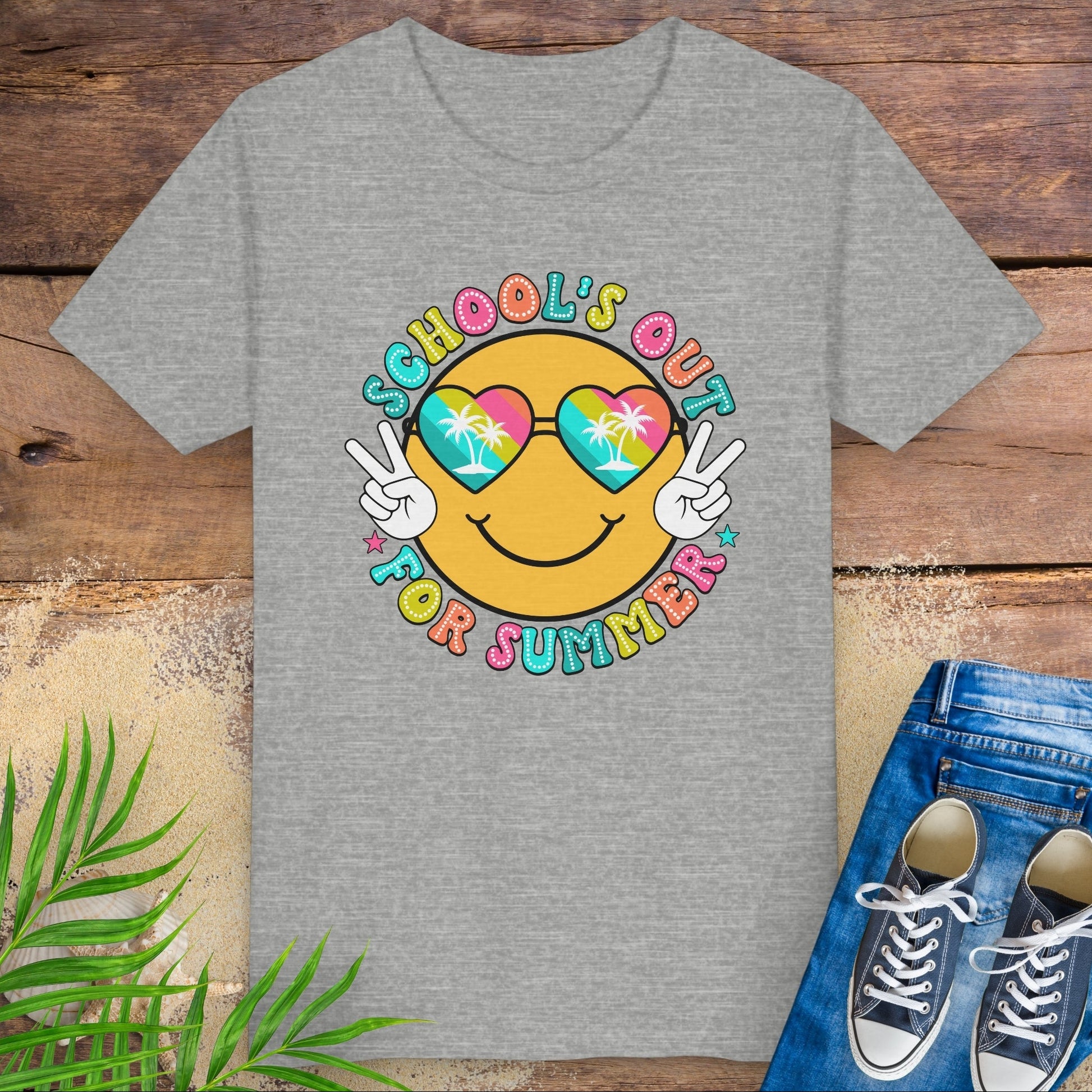 Gray kids t-shirt with “School’s Out for Summer” text and smiley face wearing heart sunglasses with palm trees, making peace signs.