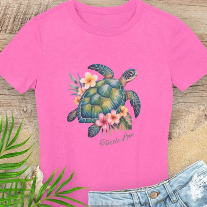 Pink woman's t-shirt with a sea turtle and hibiscus flower design.