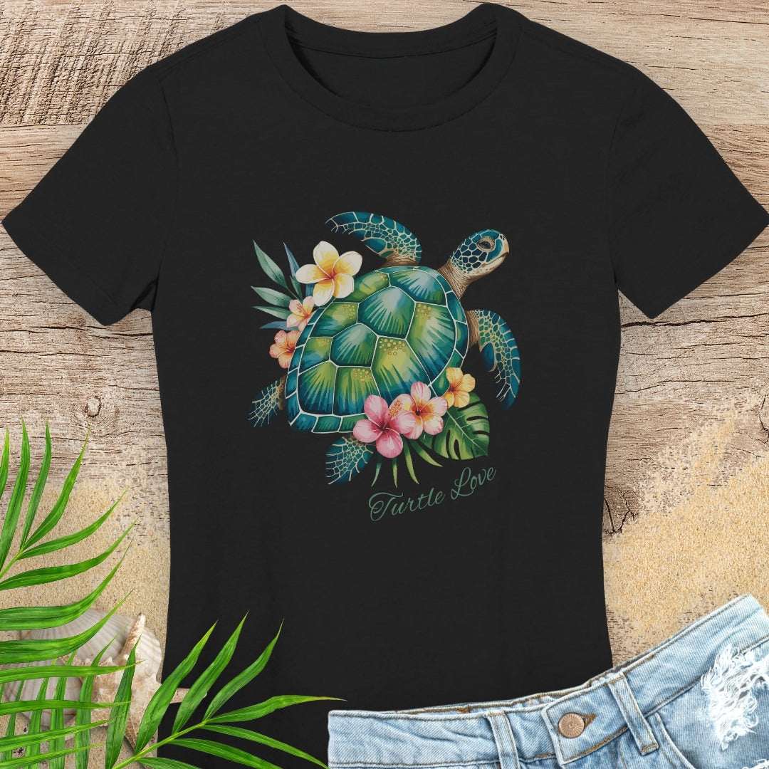 Black woman's t-shirt with a sea turtle and hibiscus flower design.