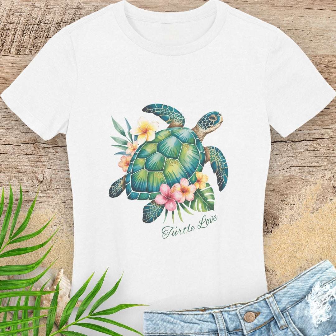 White woman's t-shirt with a sea turtle and hibiscus flower design.