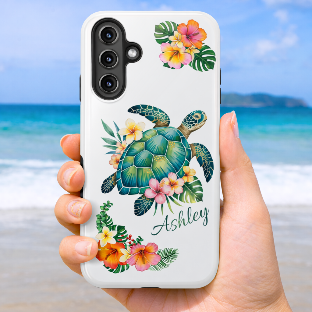Samsung 25 phone case with a sea turtle design with hibiscus flowers and can be personalized held against a beach background.