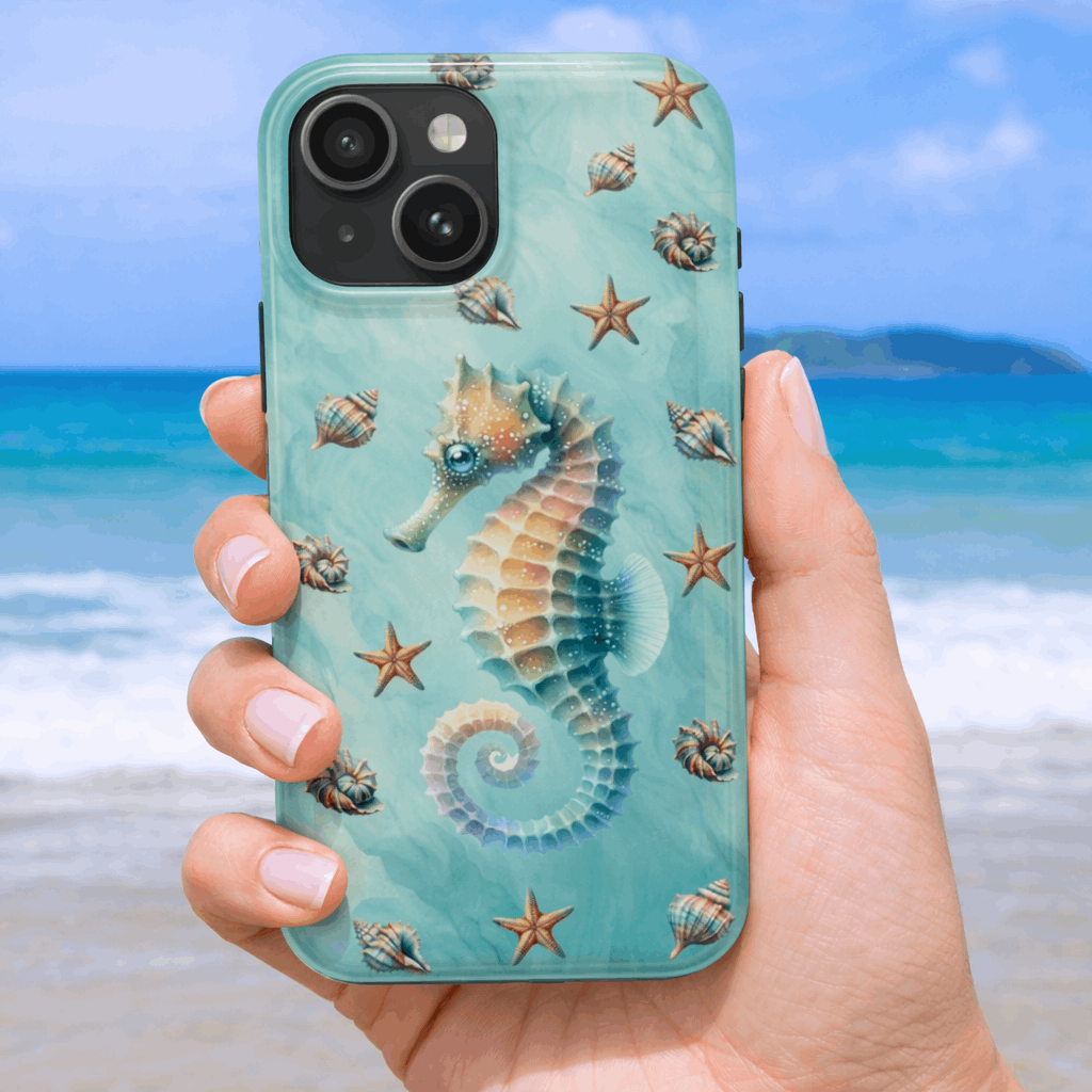 iPhone 17 pro phone case with seahorse design held by a hand on a beach