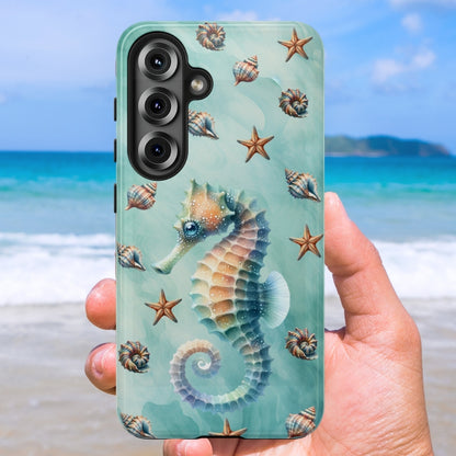 Phone case with seahorse and shell design held against a beach background