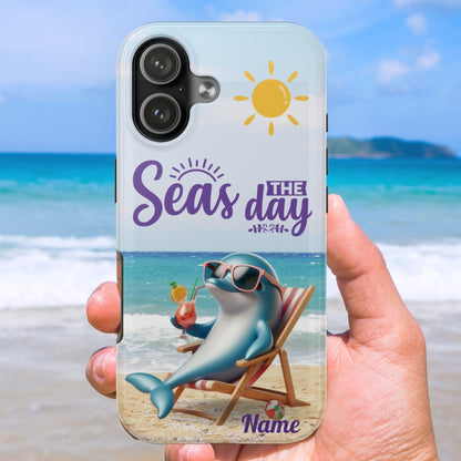 Phone case with a dolphin lounging on the beach with a cocktail and the text 'Seas the Day' and can be customized. 
