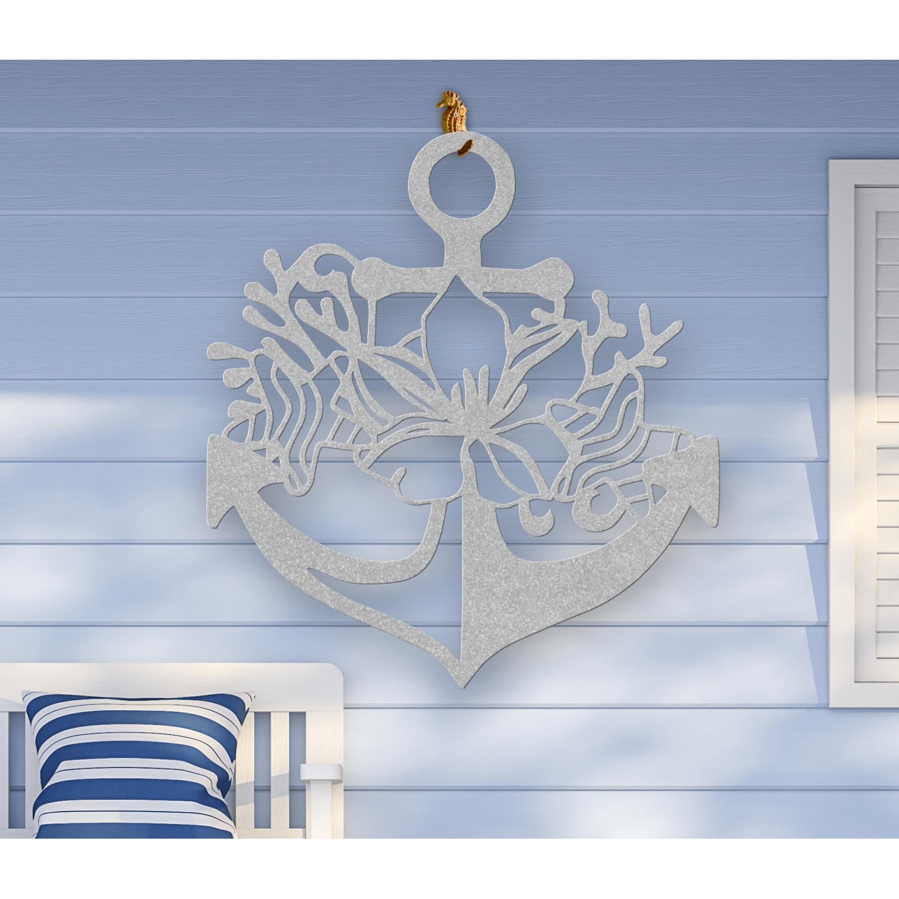 Silver metal wall art shaped like an anchor with a hibiscus flower, starfish, and shell design accents, available in 5 colors and multiple sizes.