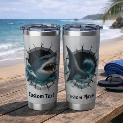 Two tumblers with shark design on a beach setting