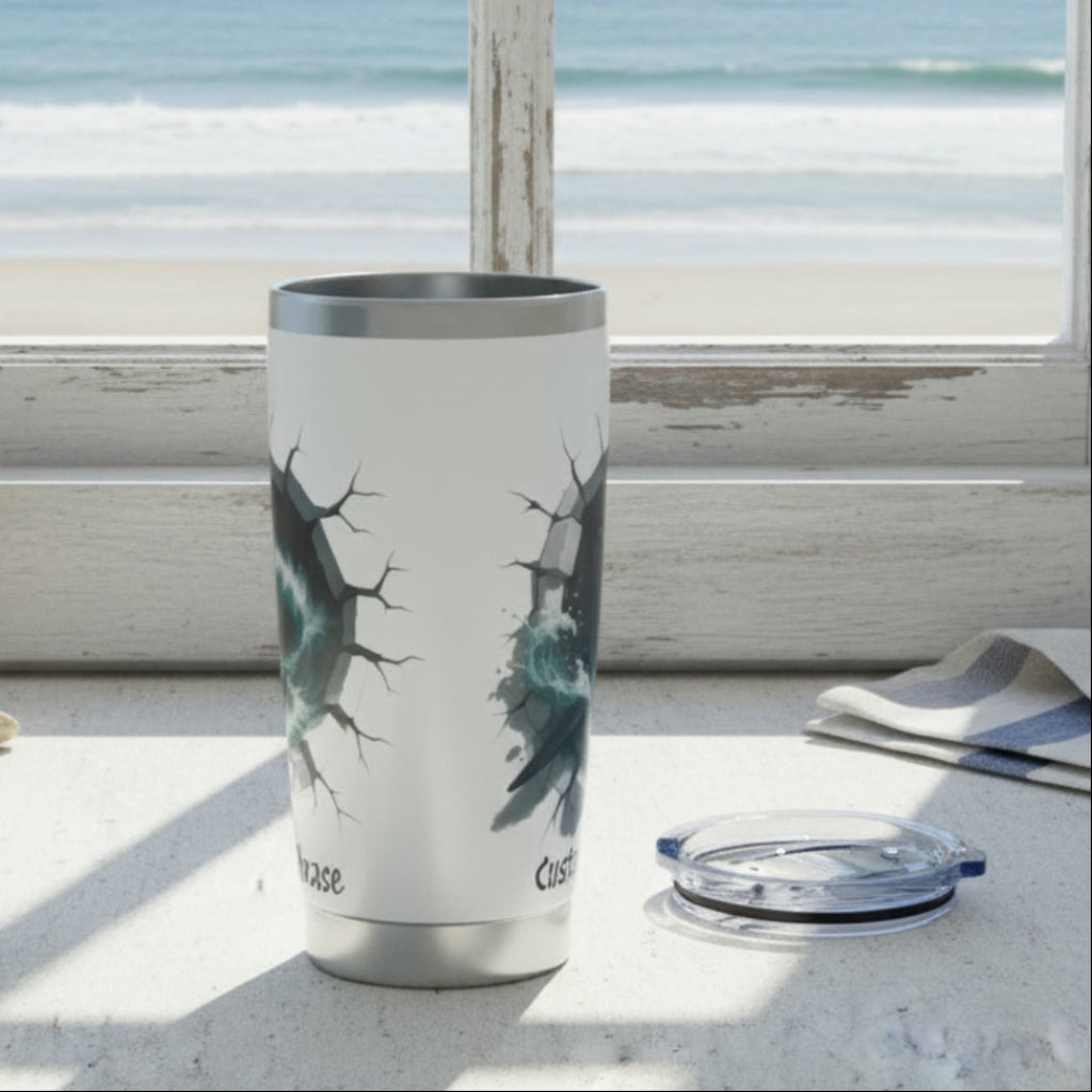 Tumbler with shark design on a windowsill with a view of the ocean.