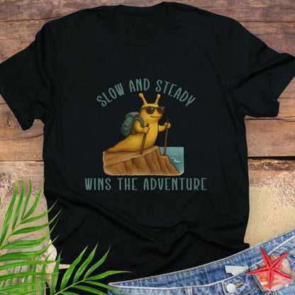 Black t-shirt with a snail graphic and text 'Slow and Steady Wins the Adventure'.