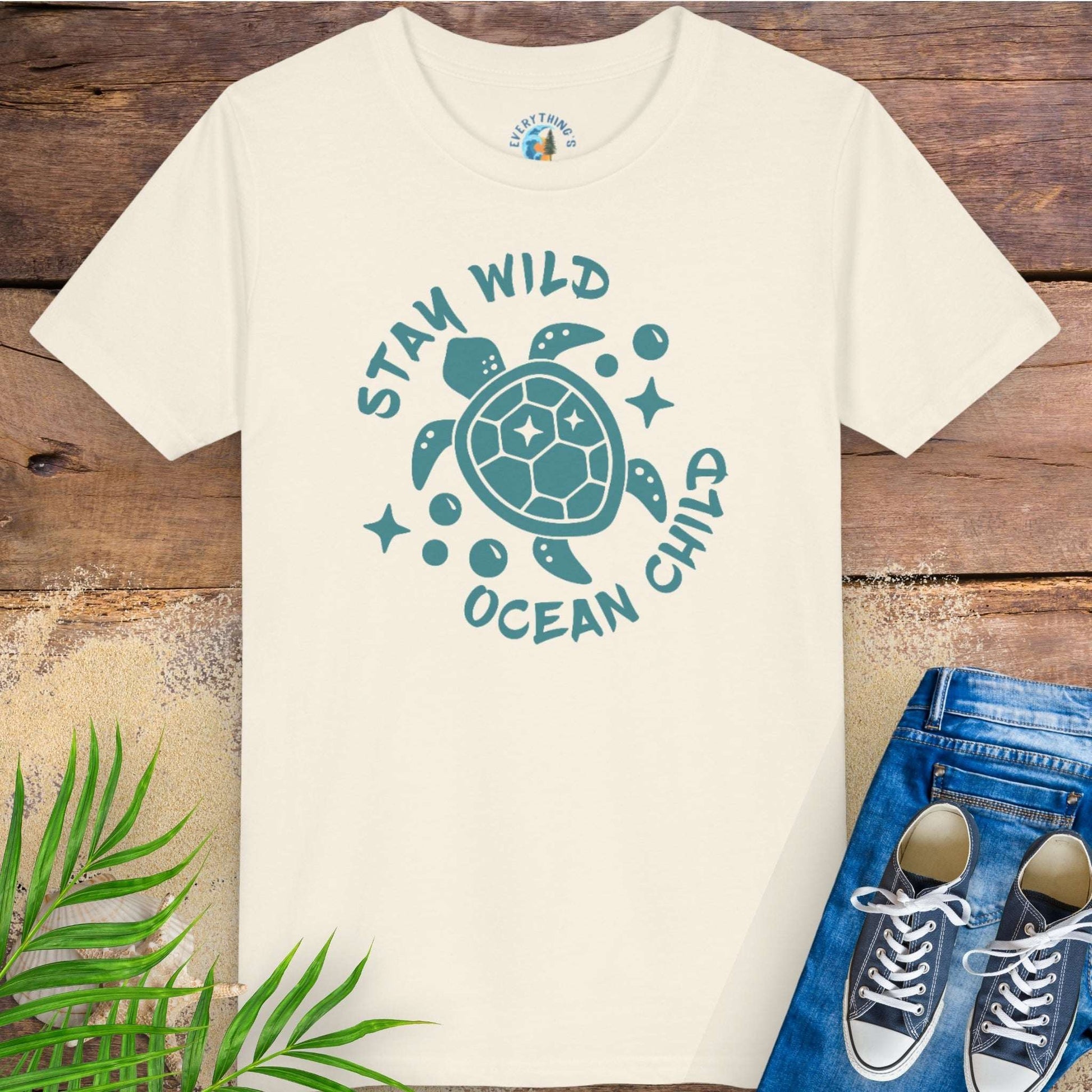 Beige t-shirt with sea turtle graphic and text stay wild ocean child.