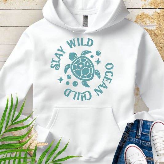 White sea turtle lover hoodie with ocean-inspired Stay Wild Ocean Child phrase around a sea turtle.