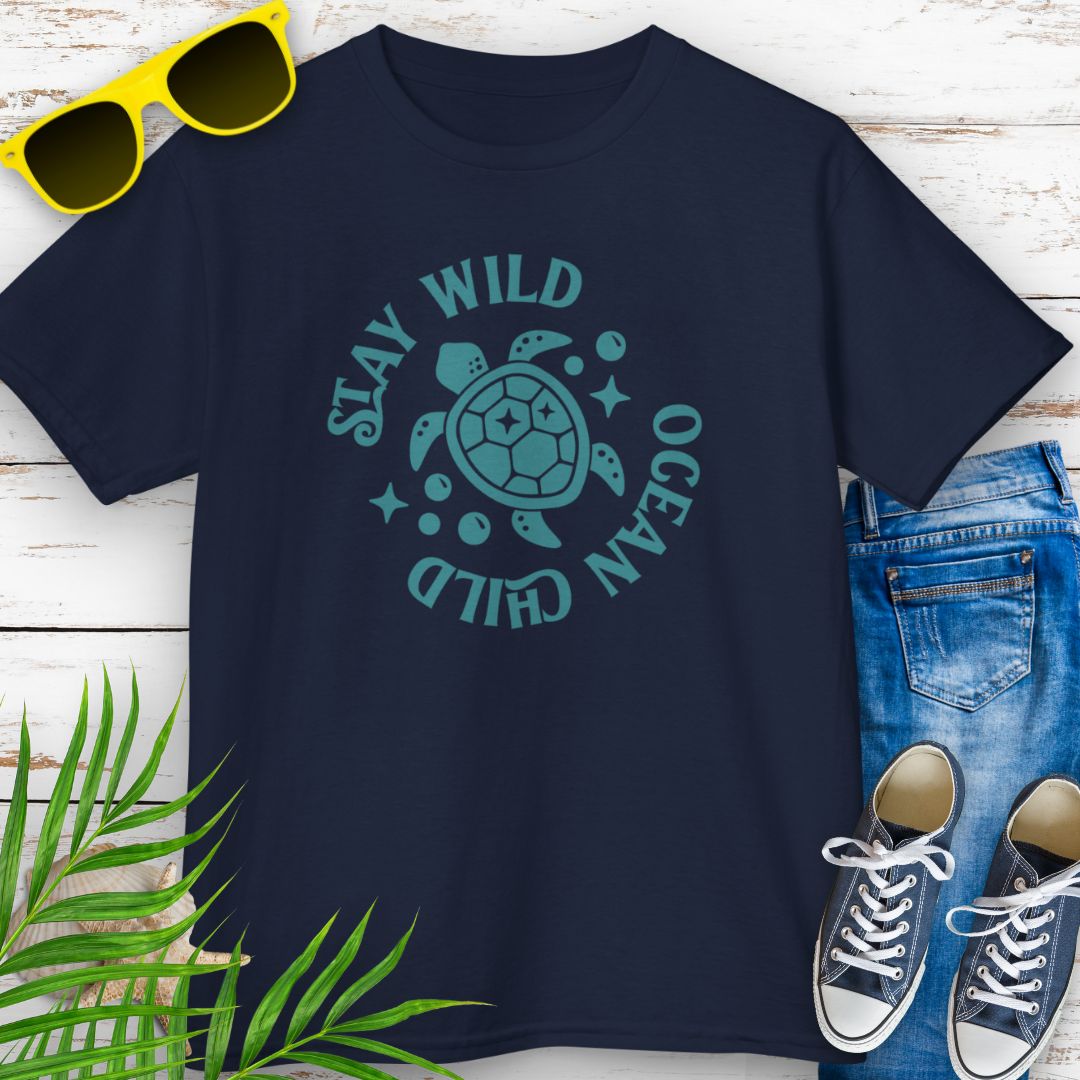 Navy kids ocean-themed T-shirt with sea turtle design and coastal vibes with phrase Stay Wild Ocean Child around sea turtle.
