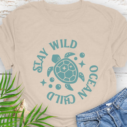Natural Stay Wild Ocean Child Sea Turtle T-Shirt featuring a sea turtle with phrase around the turtle - a beachy, free-spirited vibe for sea lovers.