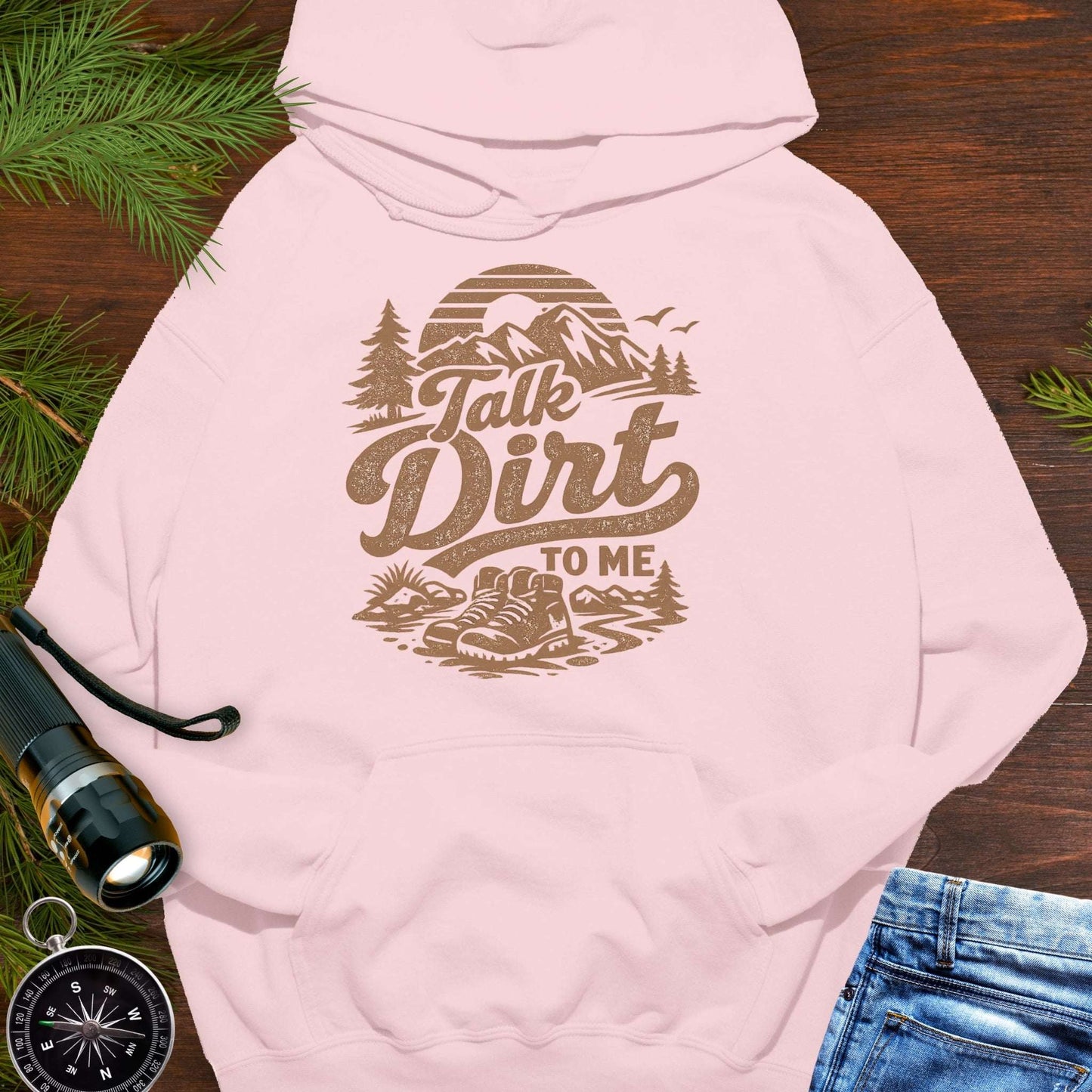 Pink hoodie with “Talk Dirt To Me” retro mountain and hiking boots graphic, outdoor adventure pullover sweatshirt.