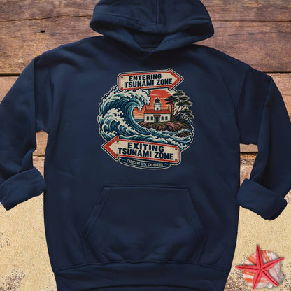 A navy blue Crescent City California hoodie design featuring a crashing ocean wave, coastal lighthouse, and vintage entering and exiting tsunami zone signs.