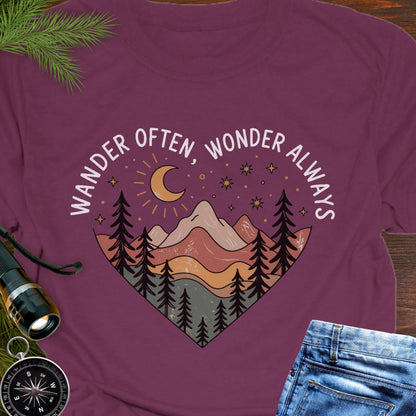 Maroon Unisex t-shirt with mountain and trees in a heart shape and the phrase "Wander Often, Wonder Always".