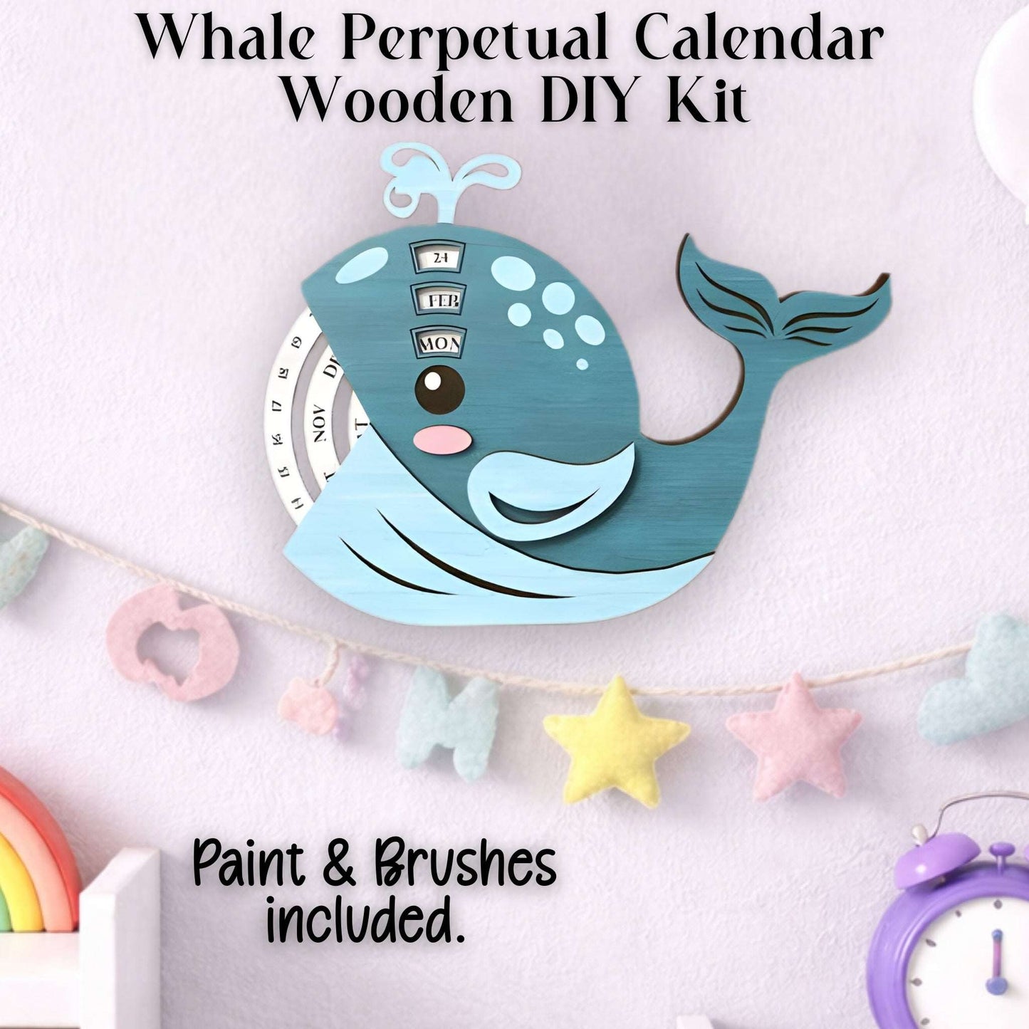 Whale-shaped perpetual calendar wooden DIY kit with paint and brushes included shown completed.